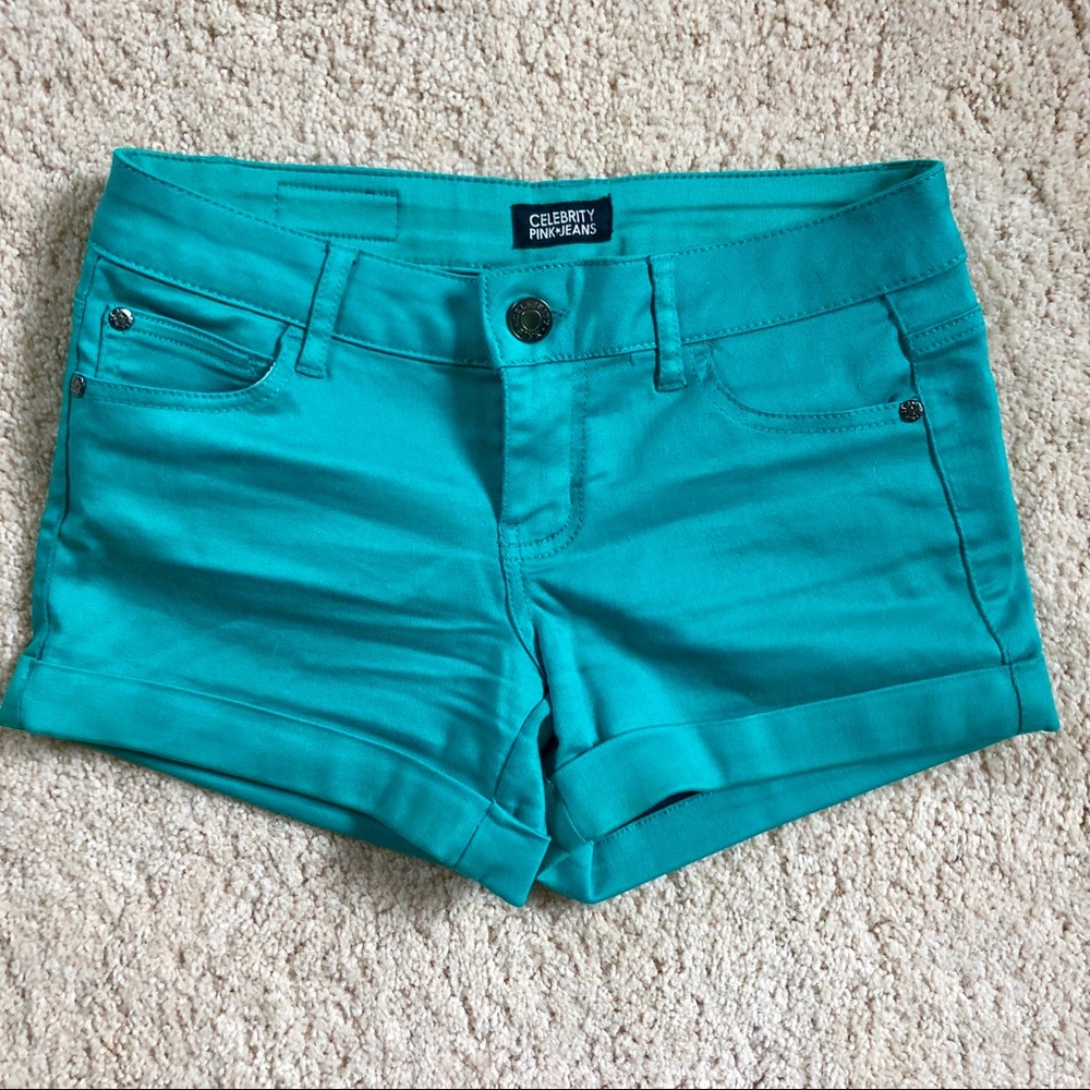 Teal colored jean shorts
